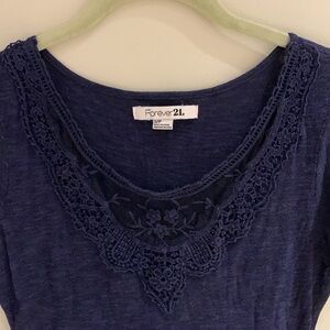 Forever 21 navy blue short sleeved dress with lace trim on the chest. Size small
